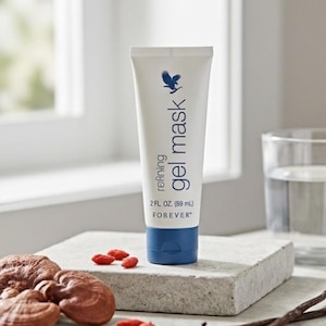 May include: A white tube of refining gel mask with blue accents, featuring a logo and the text "gel mask". The tube contains 2 fl oz (69 mL). The product is placed on a stone surface with other natural elements.