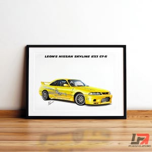 May include: A framed print of a yellow Nissan Skyline R33 GT-R car. The print features the text "LEON'S NISSAN SKYLINE R33 GT-R" at the top. The car is depicted in a dynamic pose with detailed graphics.