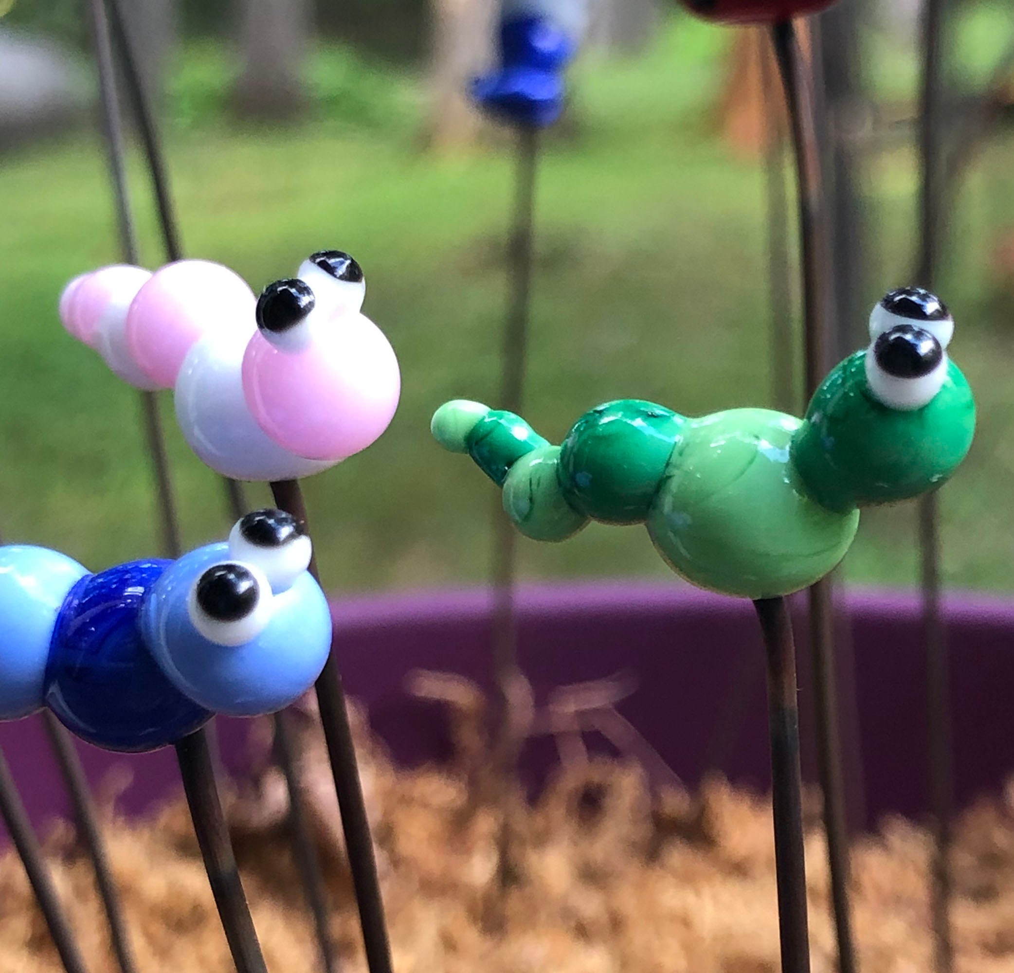 Glass caterpillar garden charm on stainless steel wire