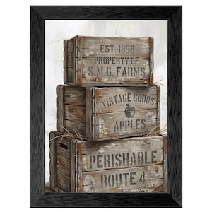 May include: A framed print featuring three stacked, weathered wooden crates. The top crate reads "EST. 1898 PROPERTY OF S.M.G. FARMS." The middle crate says "VINTAGE GOODS APPLES" with an apple graphic. The bottom crate reads "PERISHABLE ROUTE 4."