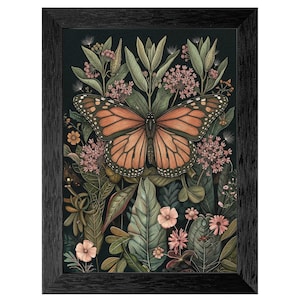 May include: A framed art print featuring a monarch butterfly with orange and black wings, surrounded by lush green foliage and pink flowers. The artwork has a dark background and is encased in a black frame, creating a nature-inspired aesthetic.