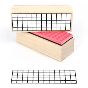 May include: A wooden stamp with a grid pattern. The stamp is mounted on a red and black base. The grid pattern is made up of 10 rows and 10 columns of squares.