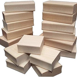 May include: A set of 20 unfinished wooden blocks, ideal for crafting and DIY projects. The blocks are rectangular and have a smooth, natural wood finish.