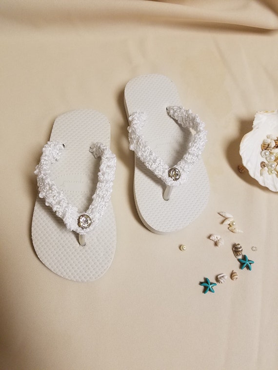girls white flip flops