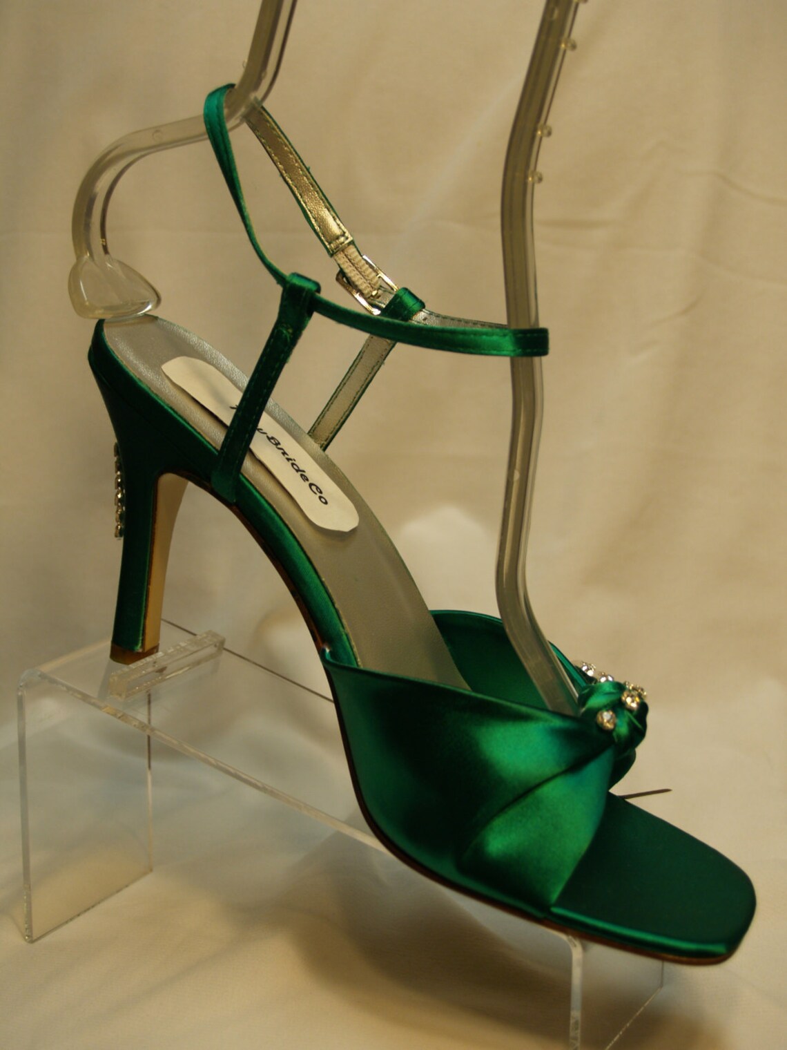 emerald green dress and silver shoes