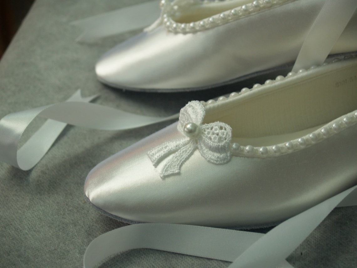 white satin ballet shoes with ribbon