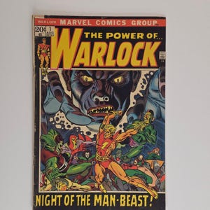 May include: A vintage comic book cover featuring the title "The Power of Warlock" with the text "Night of the Man-Beast!". The cover art depicts a battle scene with a central figure in a red and yellow costume, surrounded by other characters and a large monster.