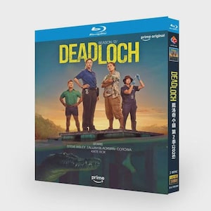 May include: A Blu-ray disc case for "Deadloch" Season 2. The cover features a teal background with the show's title in yellow and a group of four people standing on a platform. The Prime Video logo is visible.