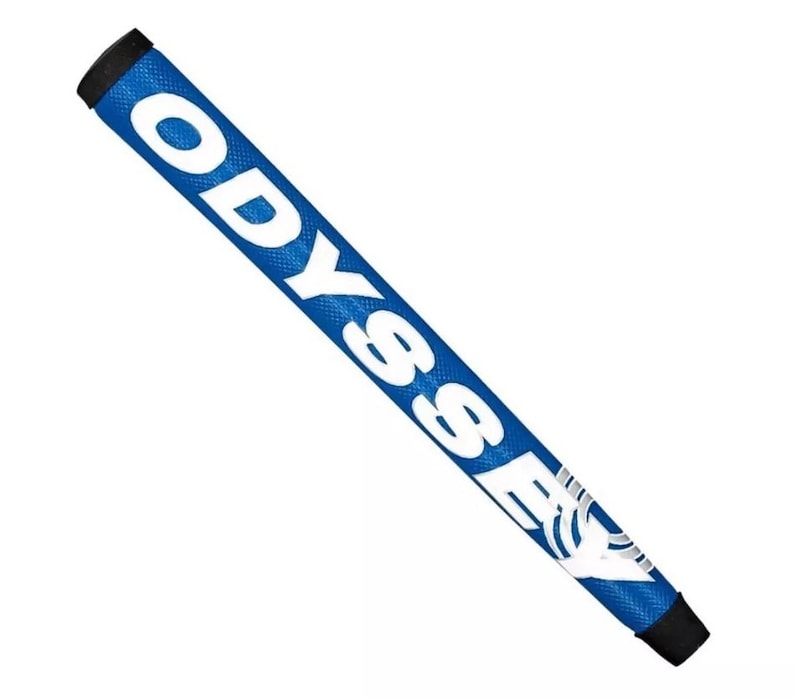 May include: A blue golf putter grip with the word "ODYSSEY" in large white letters. The grip has a textured surface and black end caps. The Odyssey logo is visible at the end of the grip.