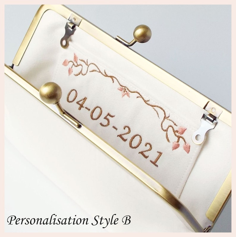 example of personalised date in bronze lettering with floral border in bronze and rose pink threads embroidered onto interior slip pocket of handmade clutch bag