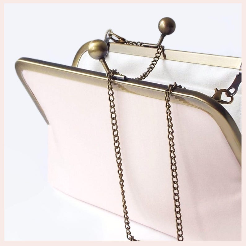 pale pink wedding clutch bag with Antique Brass tone kisslock frame and chain has white lining
