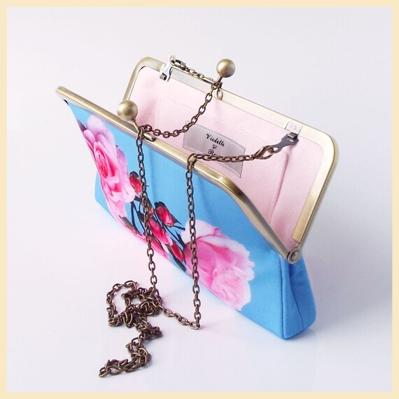 pink and blue clutch bag