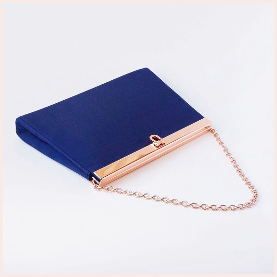 navy blue and gold clutch