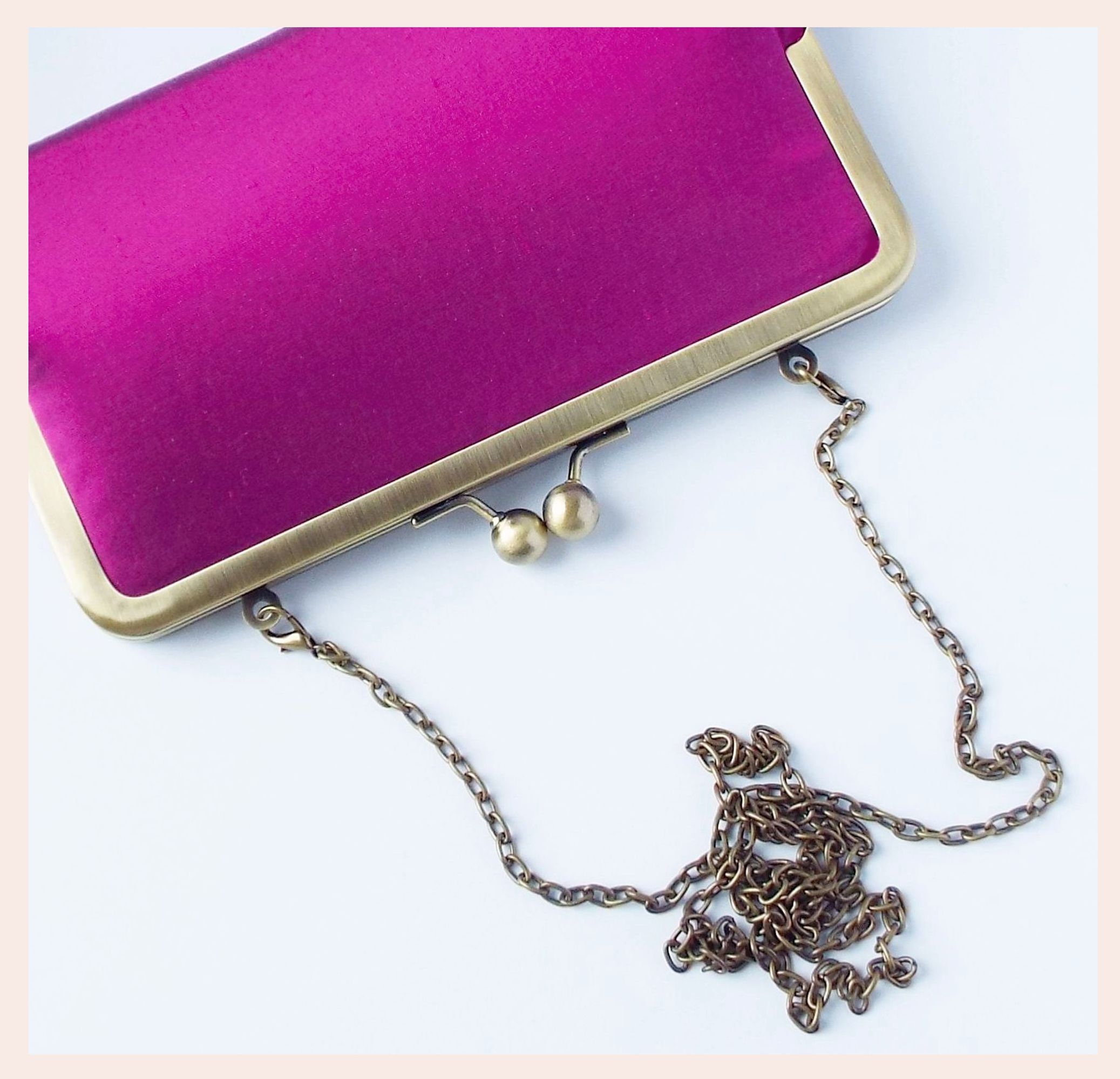 Fuchsia clutch hotsell bag