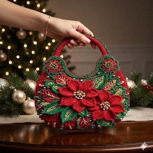 May include: A red crochet handbag featuring a prominent floral design with large red poinsettia flowers, green leaves, and gold bead accents. The bag has a rounded shape with a matching red crochet handle and intricate green trim along the edges.