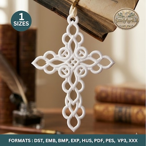May include: White, intricately designed cross ornament. The cross features a detailed, openwork pattern with a looped design. The ornament is hanging from a cream-colored ribbon. The image also includes the text "1 SIZES" and "StitchAurallB".