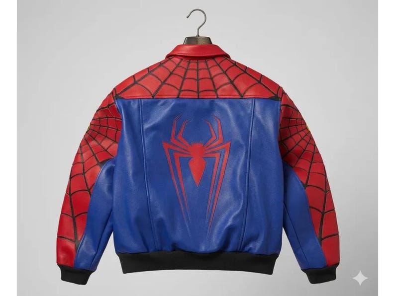 May include: A blue and red leather jacket with a Spider-Man design. The jacket features a red spiderweb pattern on the shoulders and sleeves, a blue torso with a red spider emblem, and a black hem and cuffs.