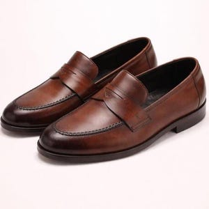 Men’s handmade penny loafers crafted from genuine leather with elegant dress shoe design