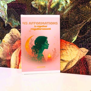 May include: A book with a pink cover. The cover displays the text "45 AFFIRMATIONS à répéter régulièrement" in orange. The illustration features a green profile, a crescent moon, and a candle. The background is a colourful, abstract design.