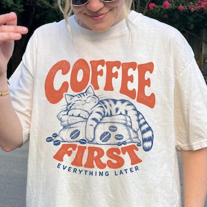 Comfort Colors® Coffee First Everything Later Shirt, Sleeping Cat on Coffee Beans Tee, Funny Cat Coffee Lover Gift, Cozy Caffeine Addict Top