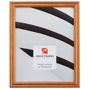 May include: A wood picture frame with a light brown finish. The frame is designed to hang vertically or horizontally. The frame is made by Craig Frames and their website is printed on the frame.