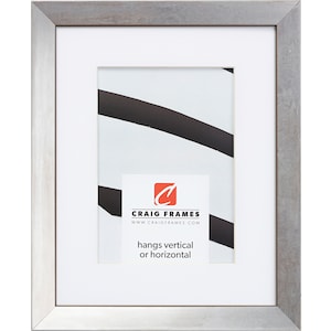 May include: A silver picture frame with a white mat and a white background. The frame has a thin, silver border and a slightly raised edge. The frame is designed to hang vertically or horizontally. The text "CRAIG FRAMES" and "www.craigframes.com" is printed on a white label inside the frame.
