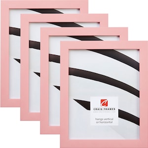May include: Set of four pink picture frames, each with a white mat and a black and white abstract design. The frames are made of wood and have a simple, modern design. The frames can be hung vertically or horizontally. The text on the bottom of the frame reads "Craig Frames www.craigframes.com hangs vertical or horizontal".