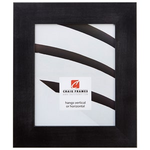 May include: Black wood picture frame with a simple, clean design. The frame is ready to hang vertically or horizontally.  "Craig Frames" and "www.craigframes.com" are printed on the mat.