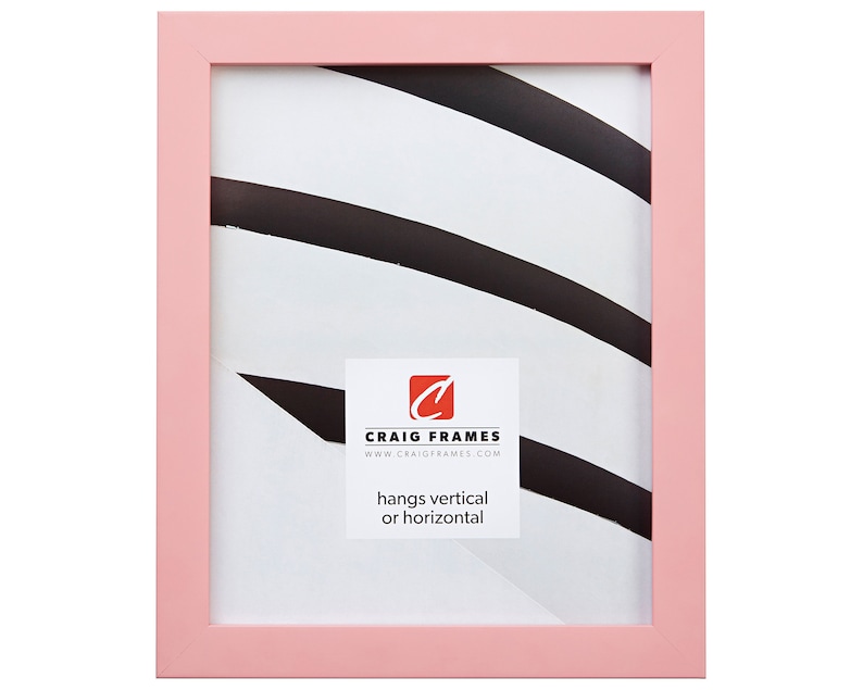 May include: A light pink picture frame with a white mat and a black and white abstract design inside. The frame is made by Craig Frames and hangs vertically or horizontally.