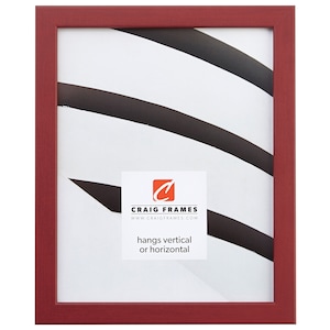 May include: A red wood picture frame with a white mat and a white background. The frame is 11x14 inches and hangs both vertically and horizontally. The text on the frame reads "Craig Frames" and "www.craigframes.com".