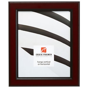 May include: A rectangular picture frame with a dark cherry wood finish. The frame has a black inner border and a white backing with a graphic design. The frame includes the text "Craig Frames" and "hangs vertical or horizontal".