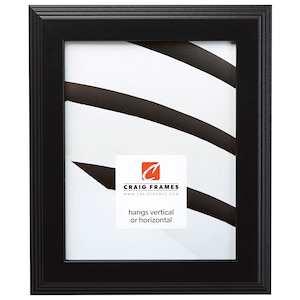 May include: Black picture frame with a simple, sleek design. The frame is made of wood and has a matte finish. It hangs vertically or horizontally.  "Craig Frames" and "www.craigframes.com" are printed on the mat.
