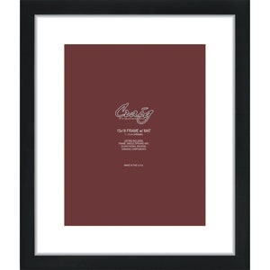 May include: A black picture frame with a white mount and a burgundy-coloured background. The frame has the text "Craig Frames" and "15x18 FRAME w/ MAT" printed on it. The frame includes clear facing, backing, and hanging components.