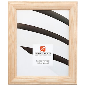 May include: A natural wood picture frame with a simple design. The frame is light brown and has a smooth finish. It hangs vertically or horizontally. Craig Frames www.craigframes.com