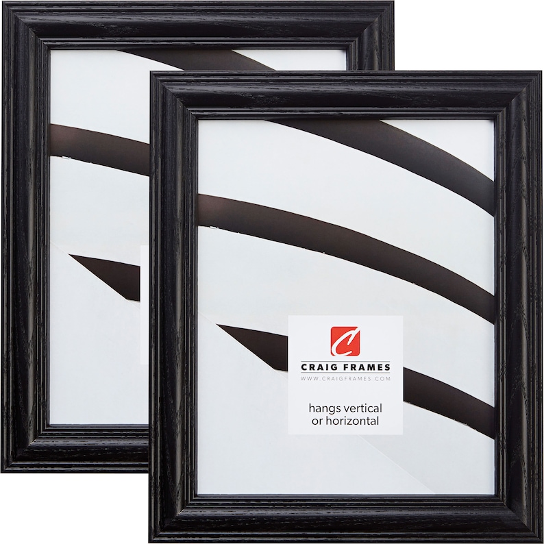 May include: Two black wood picture frames with a white mat and a white background. The frames are 8x10 inches and can be hung vertically or horizontally. The frames are made by Craig Frames.
