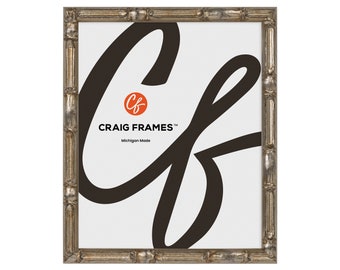 May include: A silver picture frame with a decorative, ornate design. The frame is made of wood and has a distressed finish. The frame is 8x10 inches.