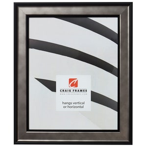 May include: A black picture frame with a silver metallic finish. The frame has a thin black border around the edge. The frame is hanging on a white wall. The text "CRAIG FRAMES" and "www.CRAIGFRAMES.com" is printed on the frame. The text "hangs vertical or horizontal" is also printed on the frame.