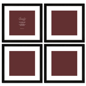 May include: Set of four black picture frames with white mats. The top left frame has a label that reads "Crazy" with the text "This frame is that" and other details. The other three frames are empty.