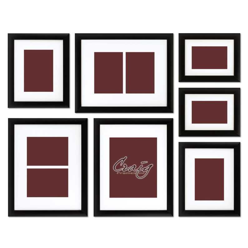 May include: A set of 7 black picture frames with white mats and brown inserts. The frames are arranged in a collage style. The largest frame has the text "Craig Frames Inc." in a cursive font.