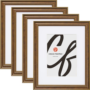 May include: Four gold-colored picture frames with white matting. The frames have a detailed, textured design. The bottom right frame displays the text "CRAIG FRAMES" and "Michigan Made".