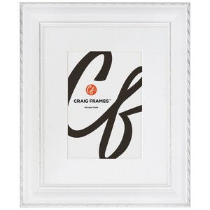May include: White picture frame with a rope-like design around the edge. The frame has a white mat and a clear opening for a photo. The frame has the text "CRAIG FRAMES" and "Michigan Made" printed on the mat.