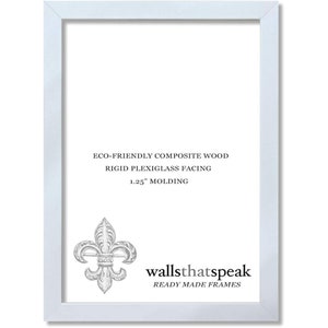 May include: White picture frame with a 1.25 inch molding. The frame is made of eco-friendly composite wood with a rigid plexiglass facing. The frame has a fleur-de-lis design and the text "wallsthatspeak READY MADE FRAMES".