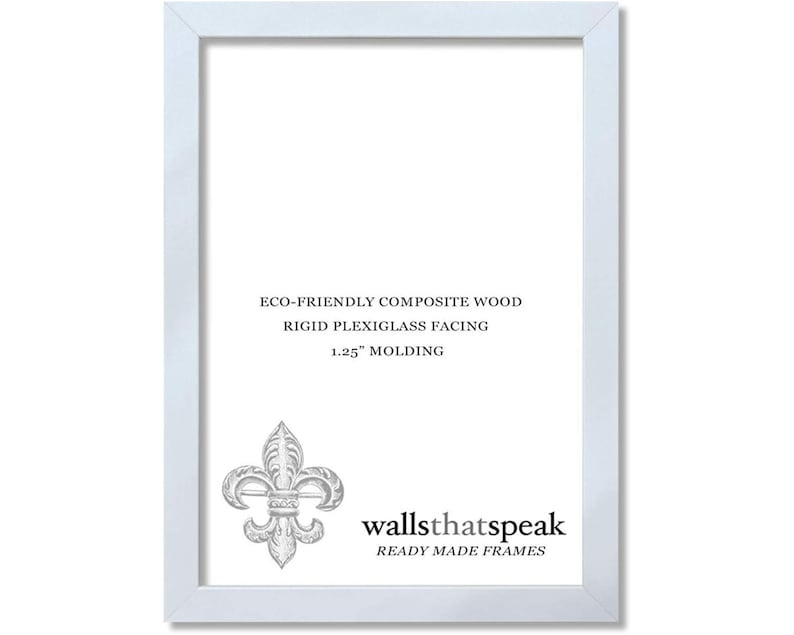 May include: White picture frame with a 1.25 inch molding. The frame is made of eco-friendly composite wood with a rigid plexiglass facing. The frame has a fleur-de-lis design and the text "wallsthatspeak READY MADE FRAMES".