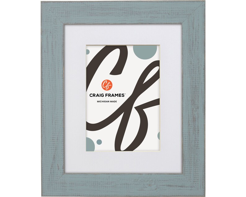 May include: A light blue picture frame with a white mat and a white background. The frame has a distressed finish and is made in Michigan. The frame is made by Craig Frames.