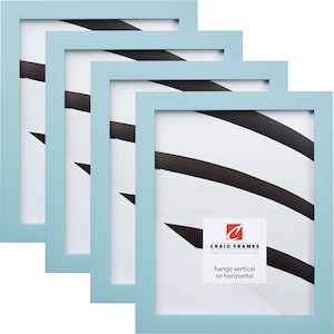 May include: Set of four light blue picture frames with a white mat. The frames are made of wood and have a simple design. The frames can be hung vertically or horizontally. The frames are made by Craig Frames.