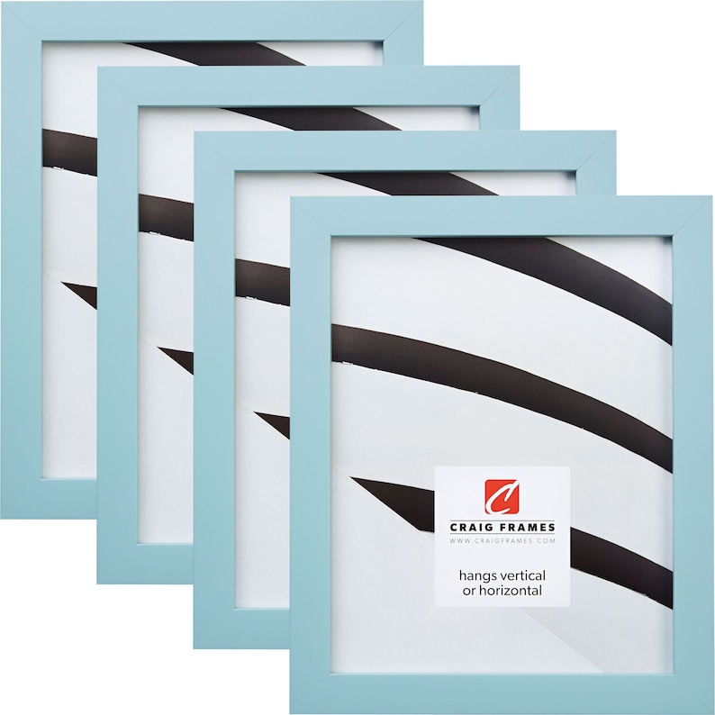 May include: Set of four light blue picture frames with a white mat. The frames are made of wood and have a simple design. The frames can be hung vertically or horizontally. The frames are made by Craig Frames.