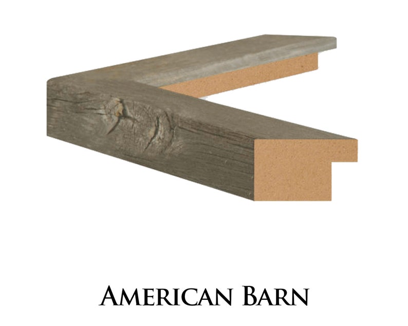 May include: Close-up of a corner of a rustic wood picture frame with a weathered grey finish. The frame has a natural wood grain and a slightly distressed look. The frame is made of reclaimed wood and has a simple, elegant design. AMERICAN BARN is printed below the frame.