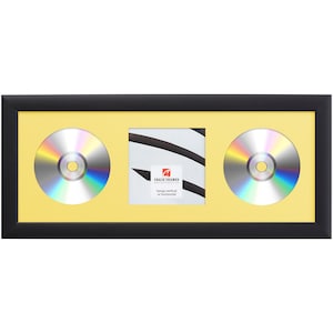 May include: Black frame with a yellow mat and two CD slots. The frame is designed to hang vertically or horizontally. The text on the frame reads "Craig Frames" and "Hangs vertical or horizontal".