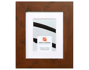 May include: A rustic brown wood picture frame with a white mat and a clear glass front. The frame is 8x10 inches and hangs vertically or horizontally. The frame is made by Craig Frames.