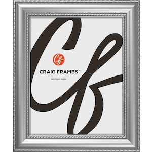 May include: A silver picture frame with a decorative rope-like border. The frame has a white mount and a black logo that says "Craig Frames" and "Michigan Made".